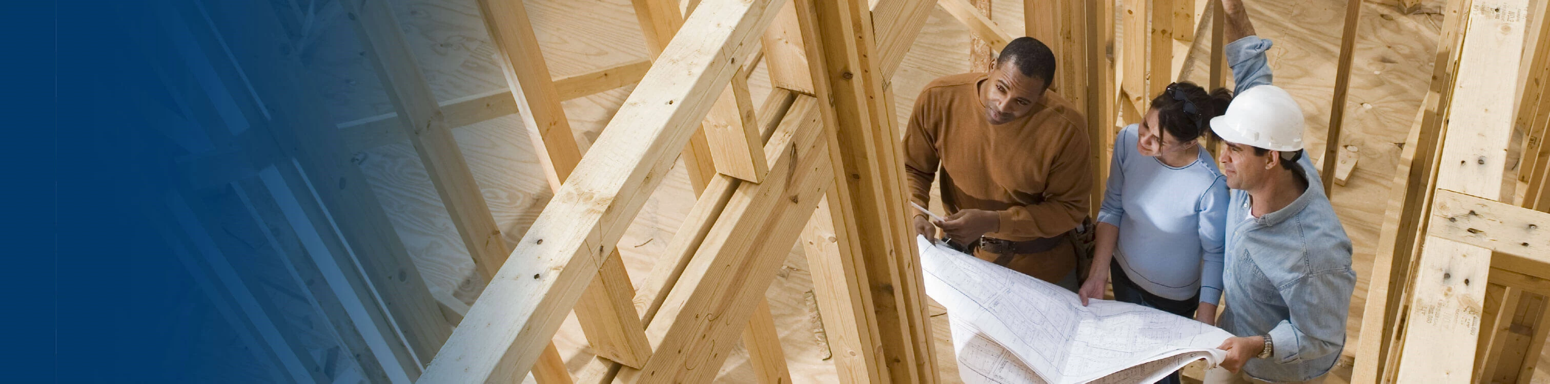 A woman looking at her blueprints of her new home