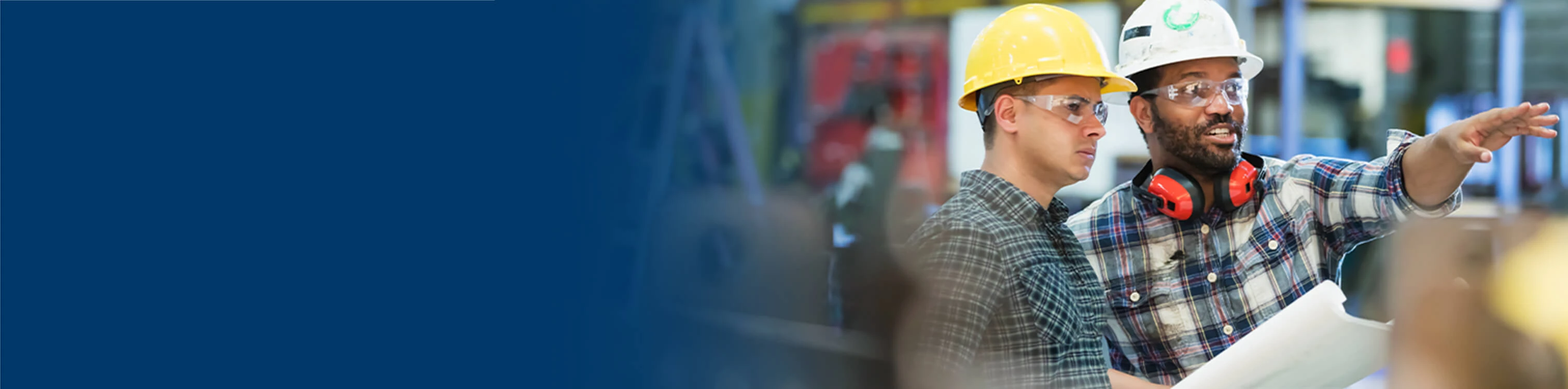 Two coworkers discussing options within the production line