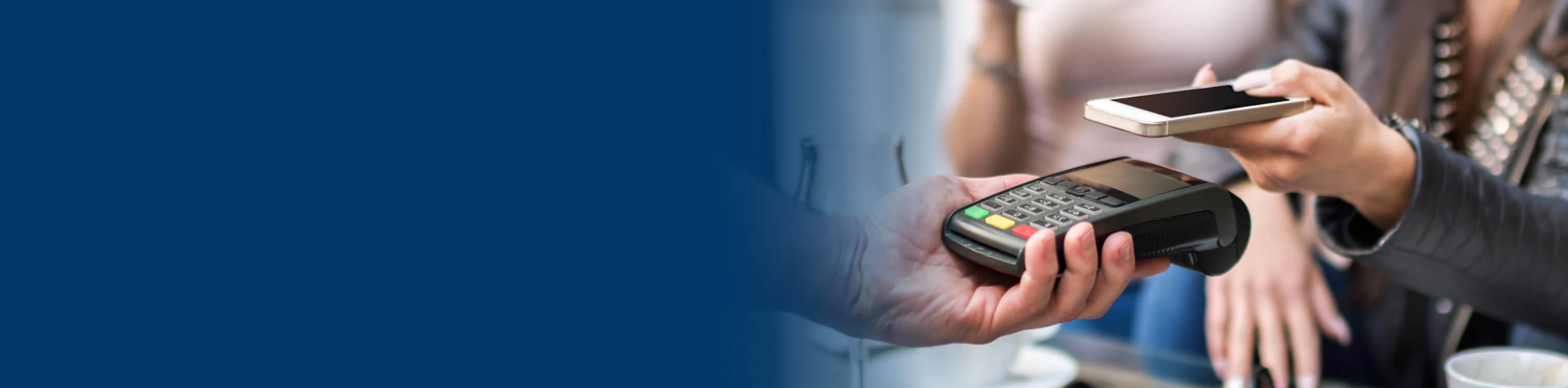 A woman paying with her mobile device