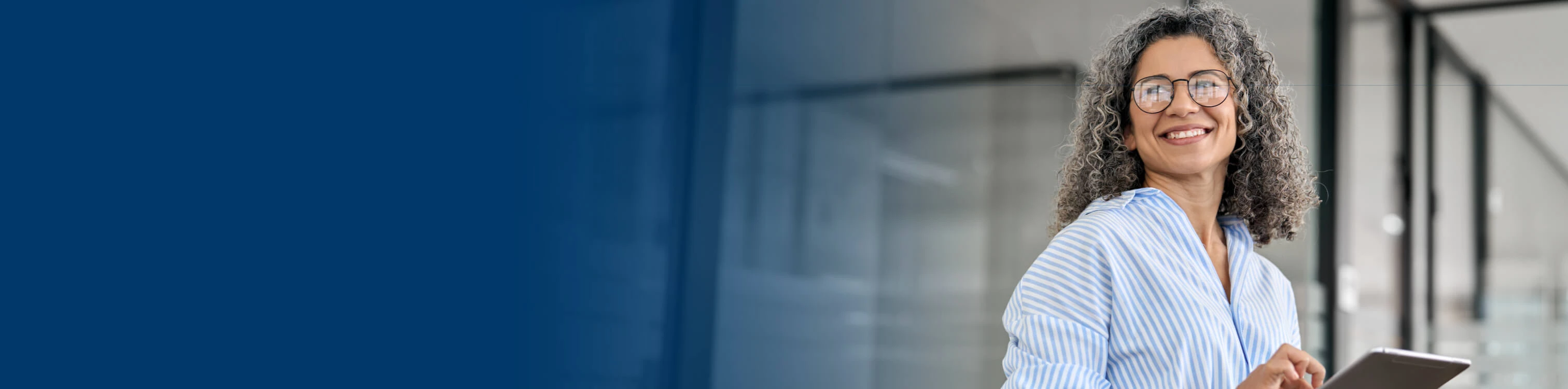 A woman in the office on her tablet